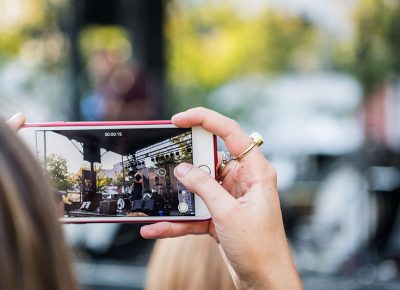 A fan snags a video during SALES' performance. Photo: ColtonMarsalaPhotography.com