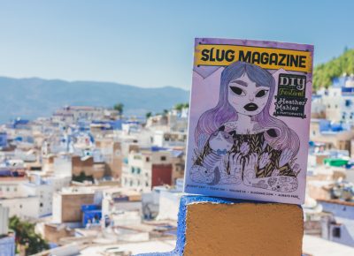 On the rooftop of the Aladdin restaurant in Chefchaouen, Morocco, SLUG Magazine overlooks the medina below. Photo: Talyn Sherer