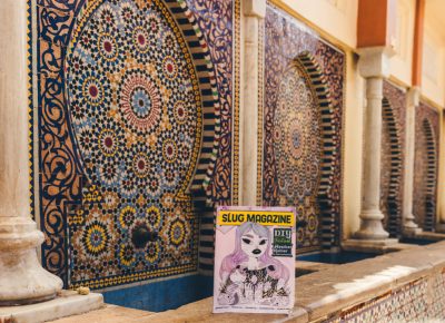 In the city of Fez, Morocco, a SLUG Magazine rests in the shade next to a traditional Moroccan mosaic fountain. Photo: Talyn Sherer