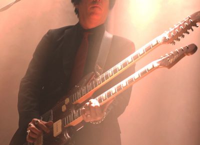 Double neck guitar being played by Troy Van Leeuwen. Photo: Lmsorenson.net