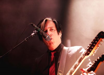 Guitarist Troy Van Leeuwen with a sweet double neck guitar. Photo: Lmsorenson.net