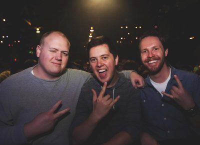 Todd, Brock and Adam snag the coveted front and center at the barricades near the stage. Fans of both Queens of the Stone Age and Royal Blood, they are in for a treat. Photo: Lmsorenson.net