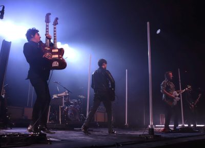 Queens of the Stone Age take the stage and set up around the tube lighting all around them. Photo: Lmsorenson.net