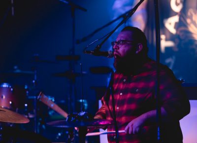 Drummer for Desi Valentine providing backup vocals. Photo: Lmsorenson.net