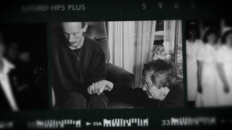 Sister Linda Bellemore of the Sisters of the Holy Cross comforting an HIV patient. Photo credit: unknown