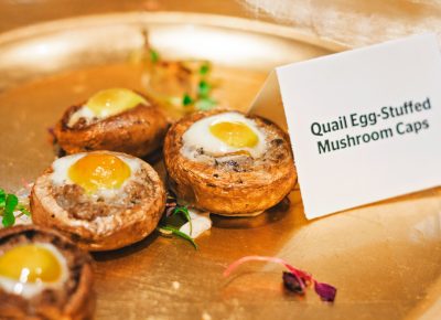 Quail-egg-stuffed mushrooms float across the room on their well-deserved golden thrones. Photo: Talyn Sherer