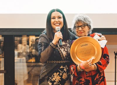 Mary Brown Malouf, executive editor of Salt Lake Magazine, receives her “Golden Palate” award given to her by her staff for her years of continued service to the food industry. Photo: Talyn Sherer