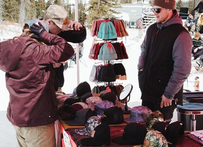 A few attendees checking out Izm’s goods. Photo: Matthew Hunter