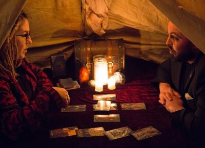 Alex Ortega listens intently to his tarot reading. Photo: Jessica Bundy