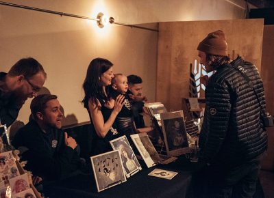 Kandace Jean utilizes her secret weapon to attract customers to her art booth. Photo: Will Cannon