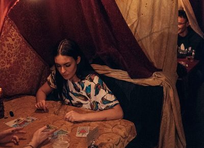 Tarot booths housed a variety of faces as they had a card reading. Photo: Will Cannon