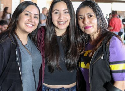 (L-R) Mariana, Andrea, and Jess were impressed by all the creativity on display. “I didn’t even know what this would be,” Mariana said. She particularly liked the F is for Fuck Trump coloring book.