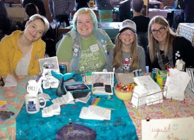 (L-R) Amanda Swain, Jayma Ostler, August Thirkill and Ashton Widdison table together. They all met through connections to Ostler, and they’re having a great time.