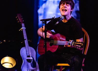 A lone Jake Bugg commands the attention of the audience seated intently below. Photo: Lmsorenson.net