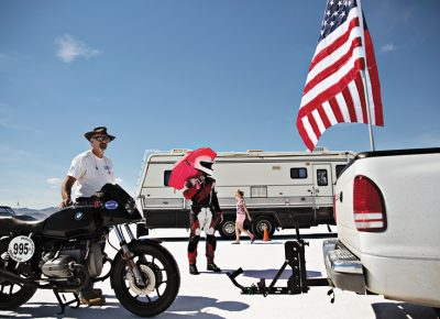 Kim Raff, "Spurs Jazz Basketball" - Paul Makarushka from Denver, Colorado shades himself with an umbrella before attempting a land speed record on his 650 CC production pushrod motorcycle. “When you look at the salt you don’t realize that it can be like concrete,” said Makarushka. “It looks like it’s soft. Like it’s snow. But it’s not. It’s just amazing. You find a groove and you just go.”