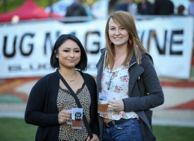 (L–R) Galilea and Balee jump right in with a Squatter’s Jalapeno Cream Ale for Galilea and a Wasatch Blueberyy Hefeweizen for Balee. Photo: John Barkiple