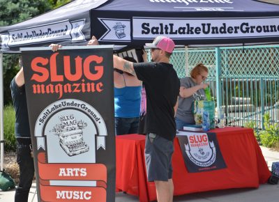 The SLUG staff setting up their booth.