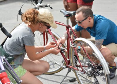 Last-minute bicycle maintenance at Saturday Cycles.