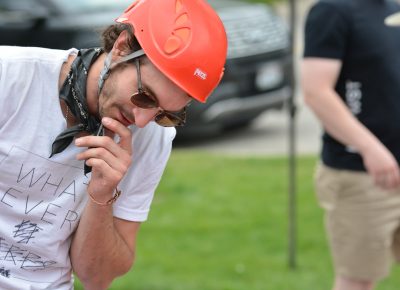 One racer provides constructive criticism on his friend's apple-bobbing technique.