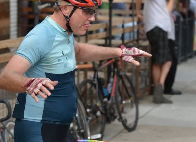 A father shows his son how to hula-hoop at the Beer Bar stop.