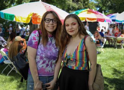 (L-R) Mia and Natasha think that Salt Lake has become more welcoming in the last five years. “A lot of Mormons are trying make an effort to actually do things in the community, and a lot of people don’t see that—they just see the part of the church that they don’t like. There’s a couple of Mormon groups in the parade, too,” Natasha said. Photo: John Barkiple