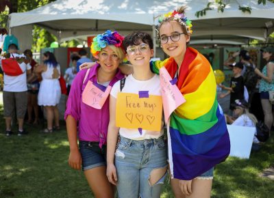 (L-R) Lindsay, Zoe and Ree rely on friends for support. Lindsay recommends the meet-ups or safe space groups on Fridays at the Utah Pride Center. Zoe likes Kaffe Mercantile. “The owners Nick and Lance are married, and they’re very kind and willing to hire people for jobs,” Zoe said. Ree appreciates that Pig & a Jelly Jar in Ogden hangs a rainbow flag all year ‘round. Lindsay and Ree were more open in high school, and they found their classmates to be accepting enough—any judgmental classmates seemed to keep their opinions to themselves. Zoe wasn’t out to anyone, so her high school experience didn’t include judgmental classmates. Photo: John Barkiple