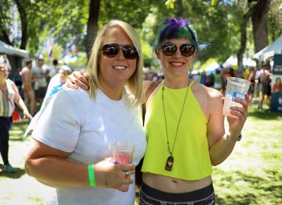 (L-R) Peri and Bailey are ready for refills. “We’ve come a long way from where we were 10 years ago. I just got an apartment down here because of how welcoming it is for the gay community. My parents are very supportive of who I’m with, and I have a great group of friends. People think that Salt Lake is super Mormon, but I think that’s a stereotype,” Peri said. Bailey grew up downtown. “I’ve been doing Pride with my neighbors as long as it’s been happening. I lived abroad for a number of years, and people knew the Utah Jazz and that there’s a good Pride. Second to San Francisco, it’s Utah’s Salt Lake City,” Bailey said. Photo: John Barkiple