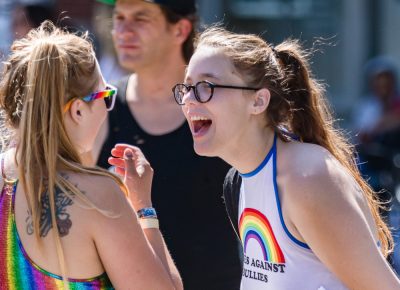 Droves of people line the streets as happy faces give shouts of encouragement. Photo: Logan Sorenson | Lmsorenson.net