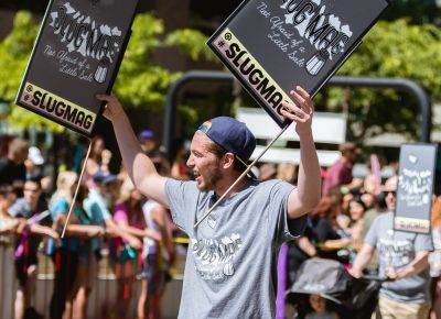 The SLUG Magazine crew shouting and waving their SLUG pride. Photo: Logan Sorenson | Lmsorenson.net