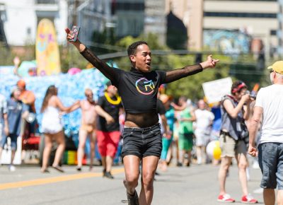 SLC Pride participants walk, dance and jump down the parade route. Photo: Logan Sorenson | Lmsorenson.net