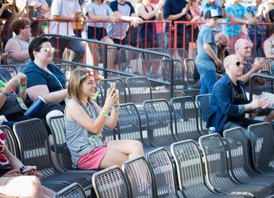 A young fan captures the moment.