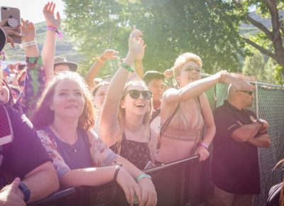 Bonanza goers dance in the summer sun.