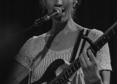 Maia laying down some backing vocals during an encore performance. Photo: Matthew Hunter