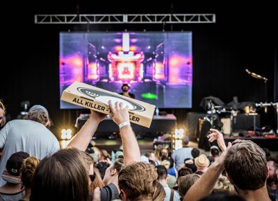 Lucky Slice pizza wonders through the crowd. Photo: Colton Marsala