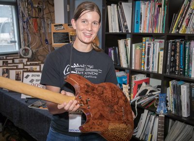 Assistant Manager Courtney Morgan represents KSM Music from Logan, Utah. She’s holding her personal guitar that was customized by her KSM colleague, David Kirkham.