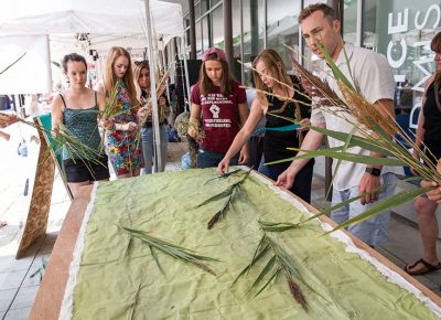 The group getting in on a collaborative piece.