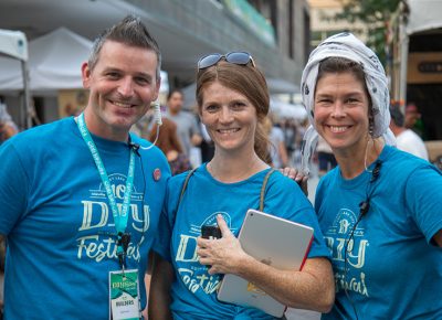 Craft Lake City Production Manager John Ford, Volunteer Meggie Trolli and Production Volunteer Aimee Horman take a break from their various duties for a quick stroll as the DIY Festival begins.