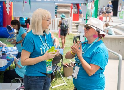 (L-R) Craft Lake City Ticketing and Finance Manager Mandy Williams and Kids’ Area Manager Inez Czech discuss the activities available in Kid Row.