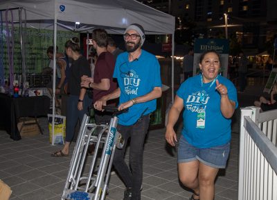 (L-R) Craft Lake City Production Coordinator Jake Vivori and Production Volunteer Danielle Turner run errands during the DIY Festival. Alongside the delicious food, lively performances and impressive art, it’s easy to spot Craft Lake City staff and volunteers hurrying from task to task as they keep the party going.