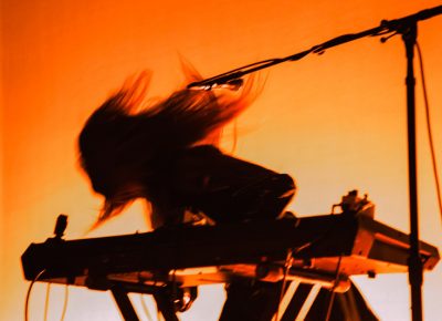 Legrand’s long, unkempt hair is a staple for Beach House performances.