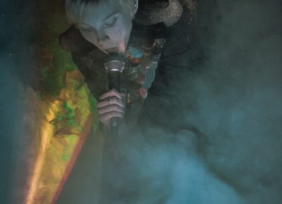 A cloud of smoke enveloping Karen as she sings.