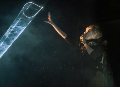 Karen interacting with the band’s on-stage laser light installation.