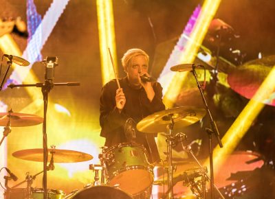 Robert DeLong playing another traditional drum kit on stage at Twilight Concert Series. Photo: Logan Sorenson | Lmsorenson.net