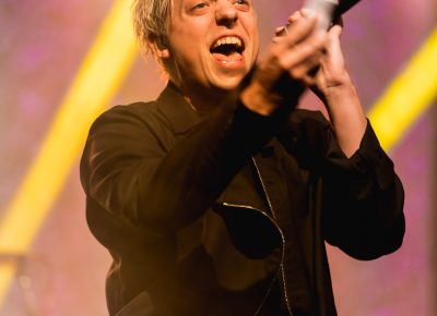 Robert DeLong on stage providing vocals as his creations loop in the background. Photo: Logan Sorenson | Lmsorenson.net