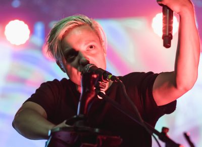 Robert DeLong on the keyboard console with mic in hand and a joystick at the ready for all the electronic alterations to his music. Photo: Logan Sorenson | Lmsorenson.net