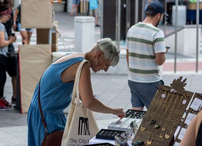 Festival goers admired the fine handcrafted jewelry.