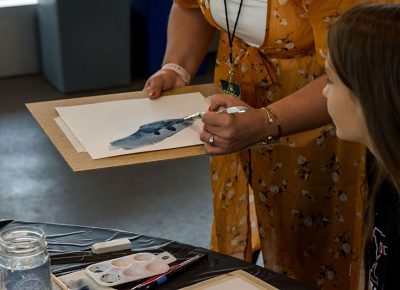 Crafters learning Watercolor tricks and tips.