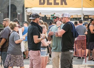 Friends share a cold one.