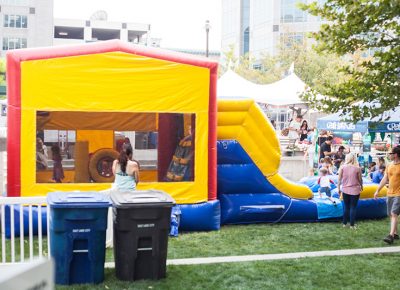 Bounce house party in the Kid's Area.