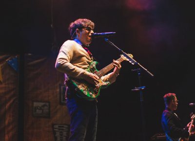 Weezer frontman Rivers Cuomo opens the night with a groundbreaking rendition of Buddy Holly.